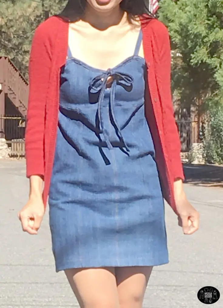Wearing a denim mini dress from old jeans with a red cardigan on top.