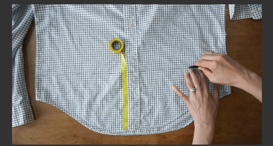 Measure up from the bottom hemline of the woven top
