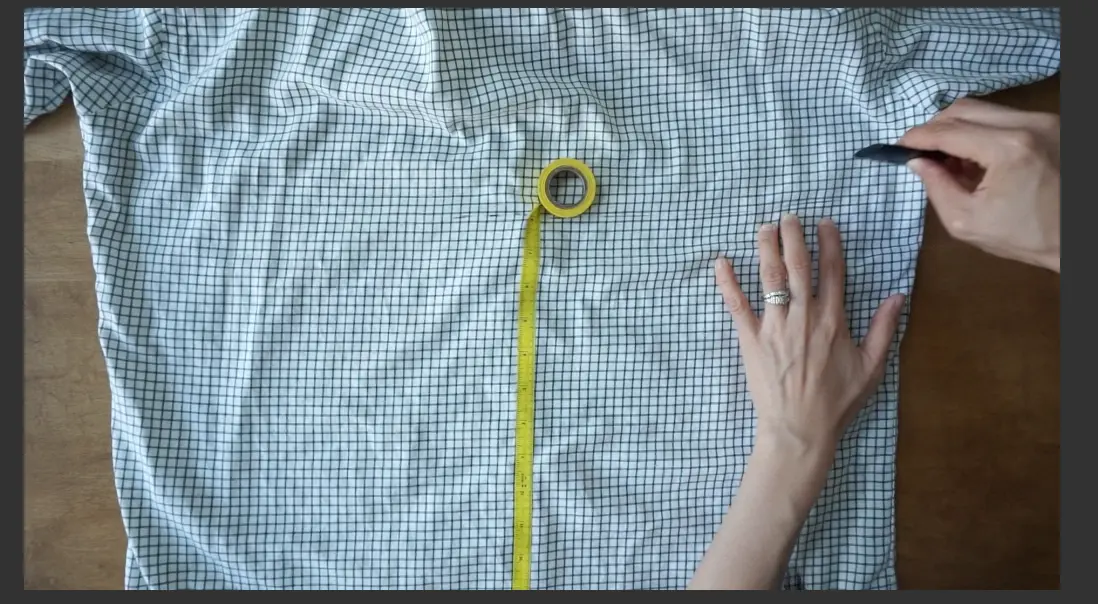 Measure and cut the back piece of the woven shirt.
