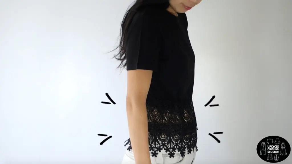 Demonstrating the ability of the lace peplum to hide the tummy. Emphasis is placed on the waistline of the peplum top.