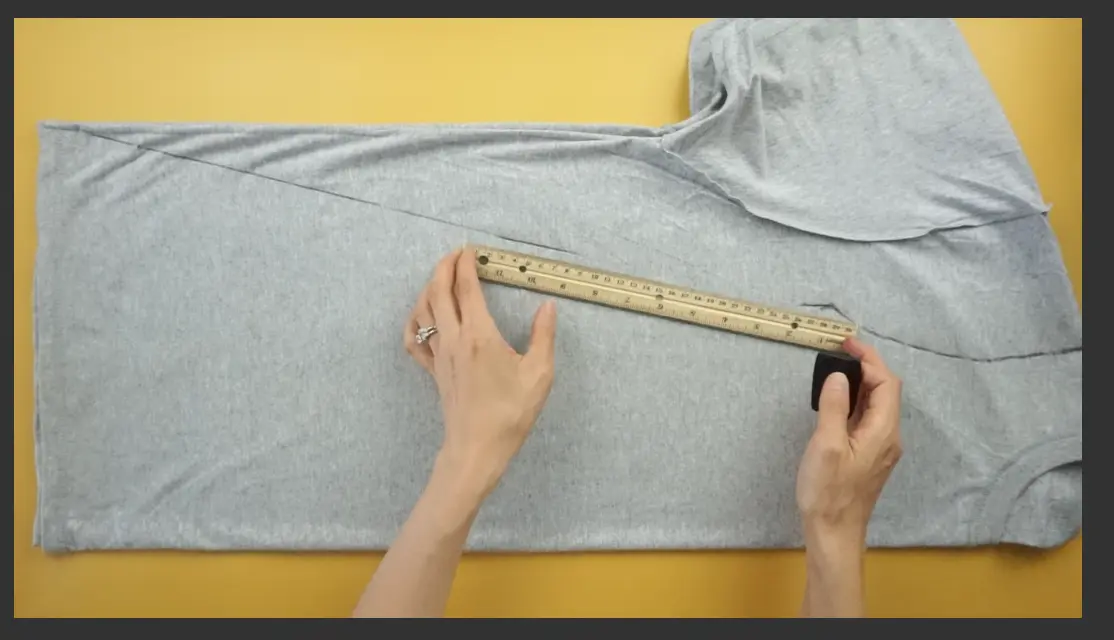 Measure and mark the A-line silhouette for the dress using fabric chalk.