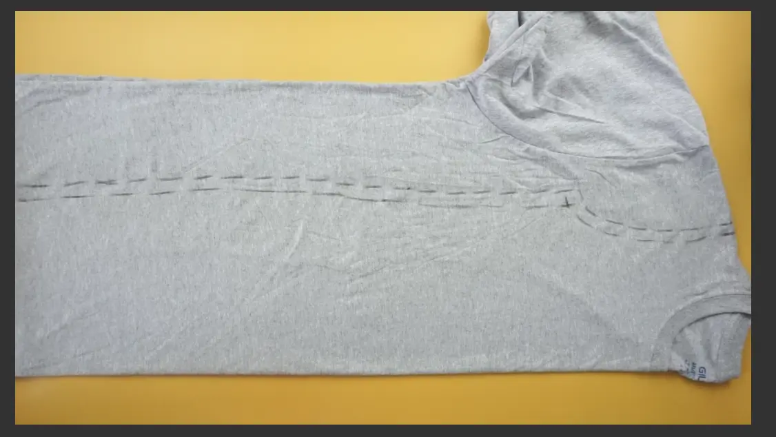Measure and mark the dress silhouette on the t-shirt using fabric chalk