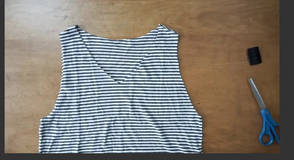 Cut along the arm opening to remove the sleeve and make the tank top