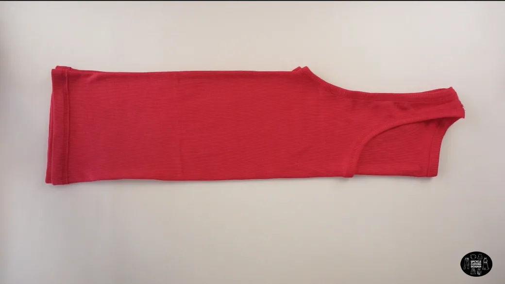 Fold the tank top in half lengthwise