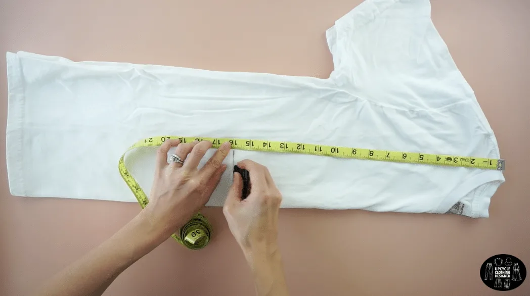 Fold the t-shirt in half lengthwise. Mark 16" down from the high point on the shoulder seam.