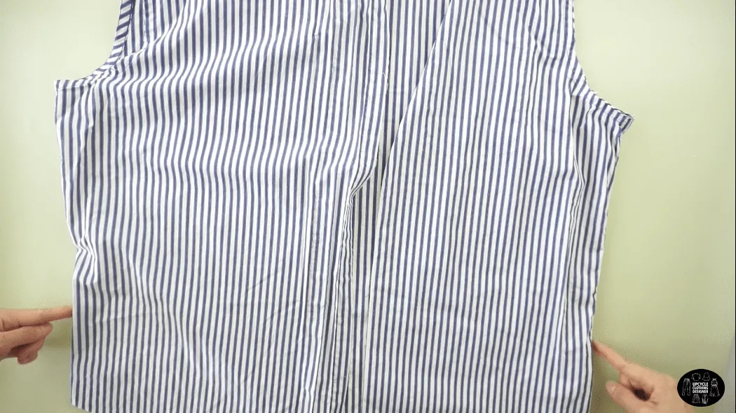 Cut open the side seams of the dress shirt to separate the chest piece from the back piece.