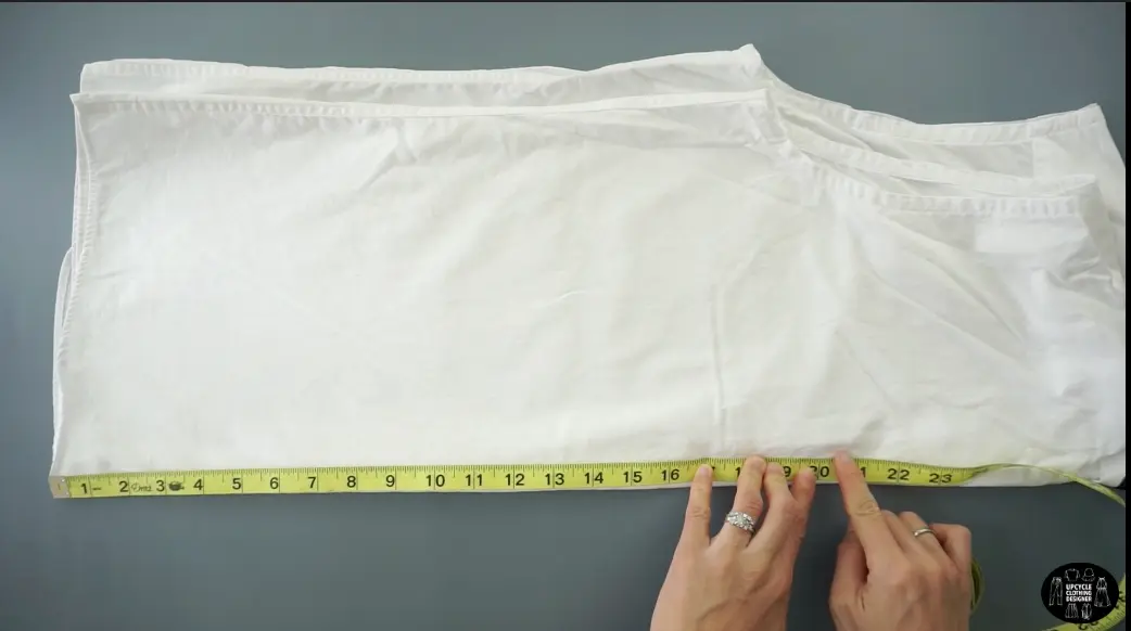 Measure 20" up from the hemline. Draw a straight line across and cut.