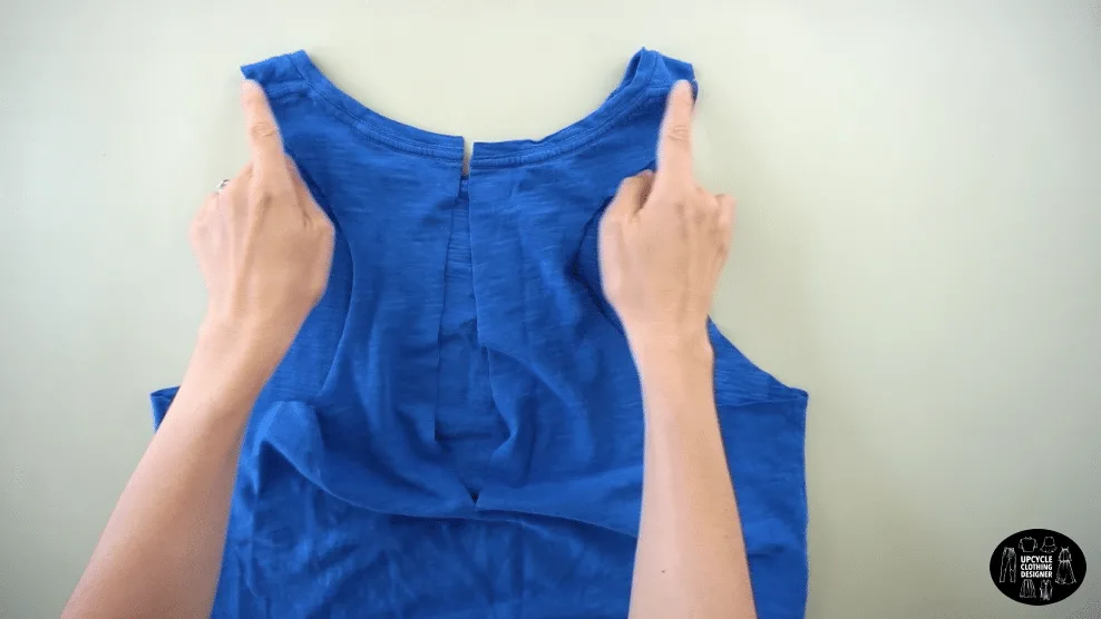 Cut the shoulder seams on the tank top to twist the cutout.