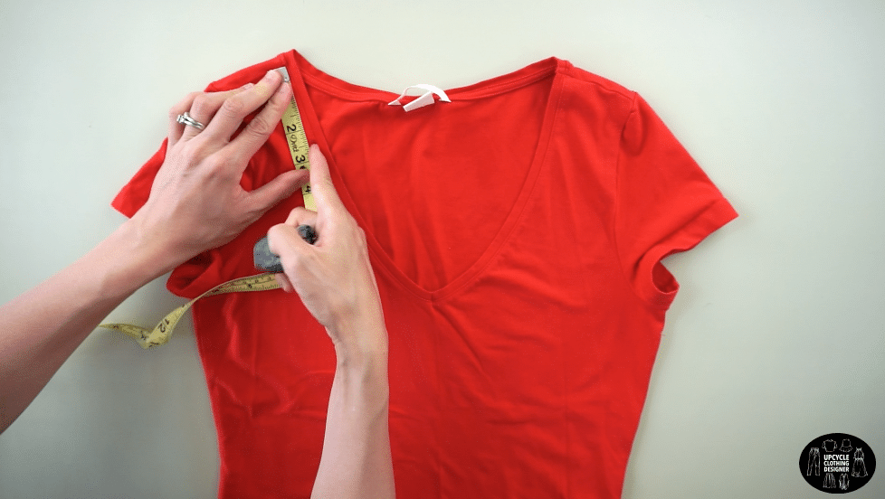 Measure 2½” down the front neckband from the high point of the shoulder.