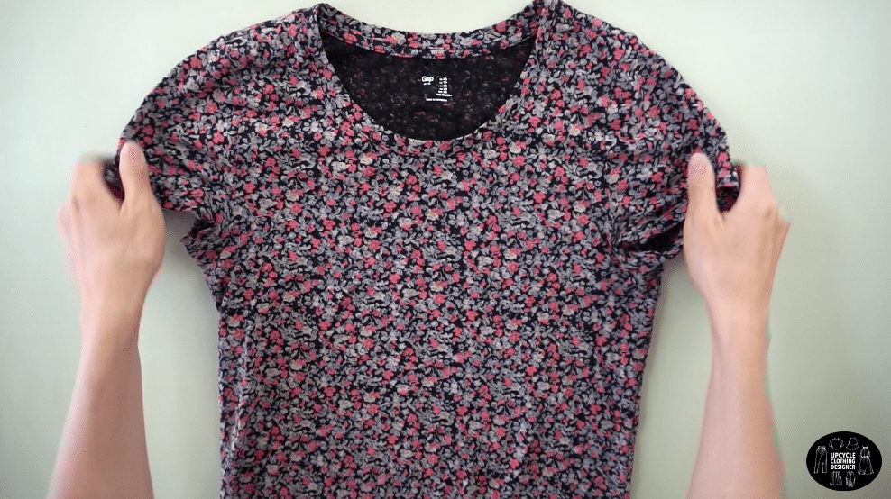 Fitted tee with floral print to make a no sew halter top using the t-shirt cutting technique.