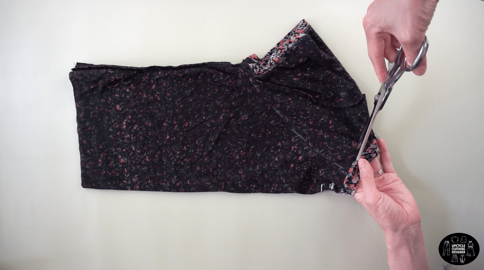 Cut the new armhole opening only on the front of the halter top.