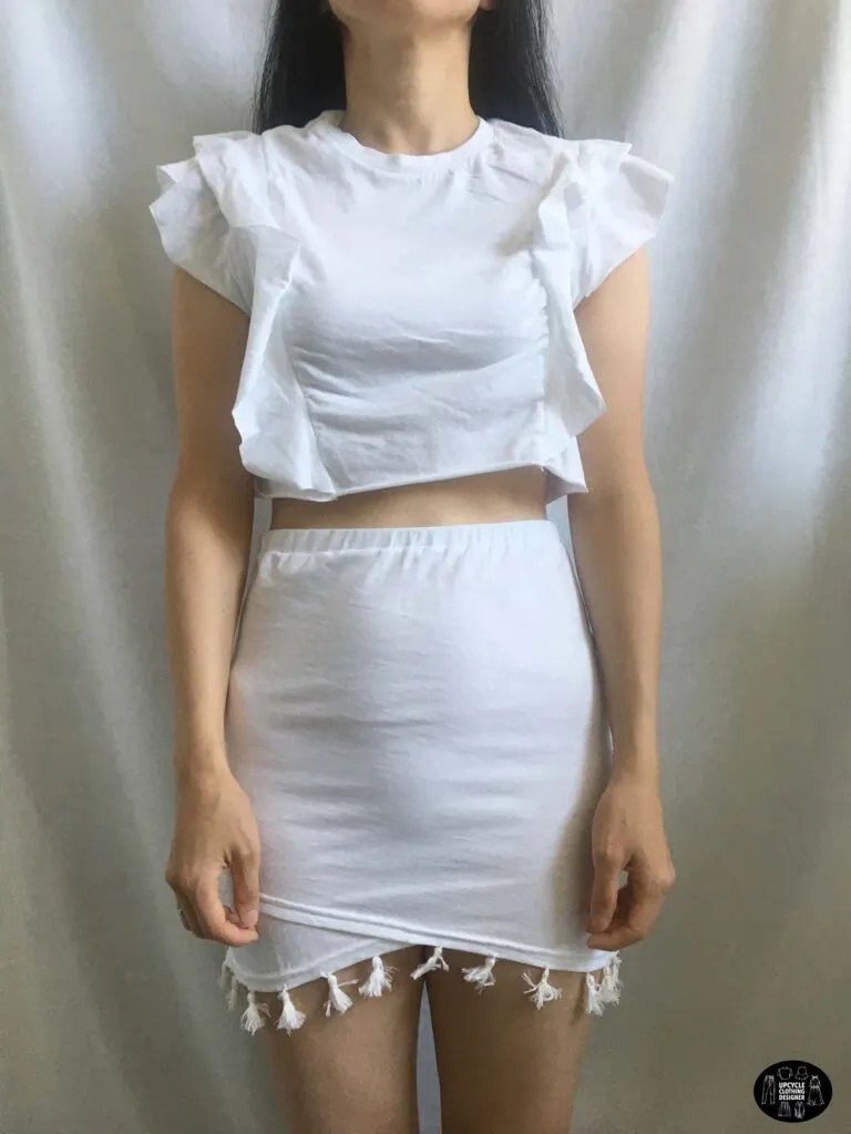 Ruffled crop top paired with the tassel trim mini skirt