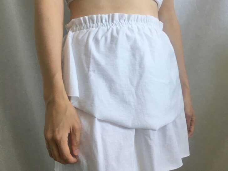 Sideview of the tiered ruffle mini skirt from a t-shirt