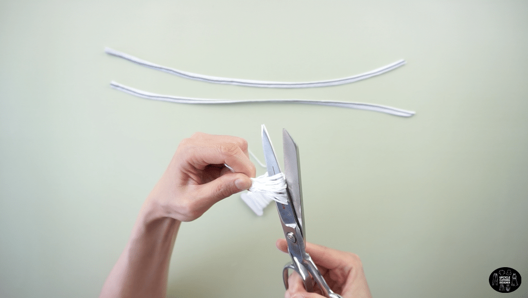 Wrap the floss around your fingers, tie a knot around one end and then cut the opposite side to complete the tassel.