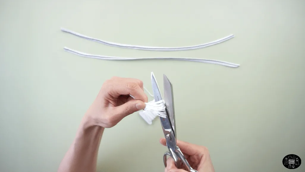 Wrap the floss around your fingers, tie a knot around one end and then cut the opposite side to complete the tassel.