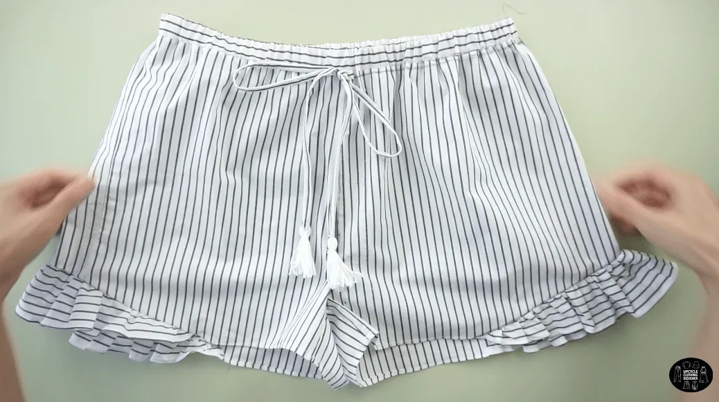 Attach the tie front straps to the center waistline of the DIY shorts from men's dress shirt.