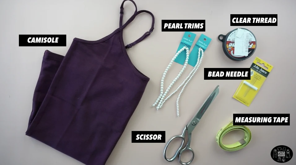 Materials to make a pearl strap camisole top.