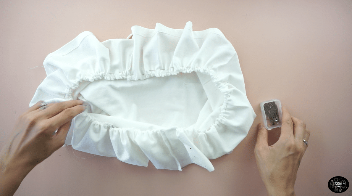 Pin the ruffle piece to the top piece with the right side facing each other. 
