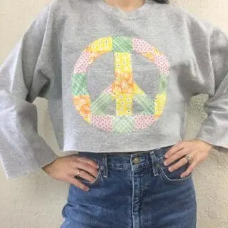 Patchwork peace sign cropped sweatshirt front