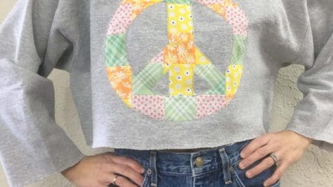 Patchwork peace sign cropped sweatshirt front
