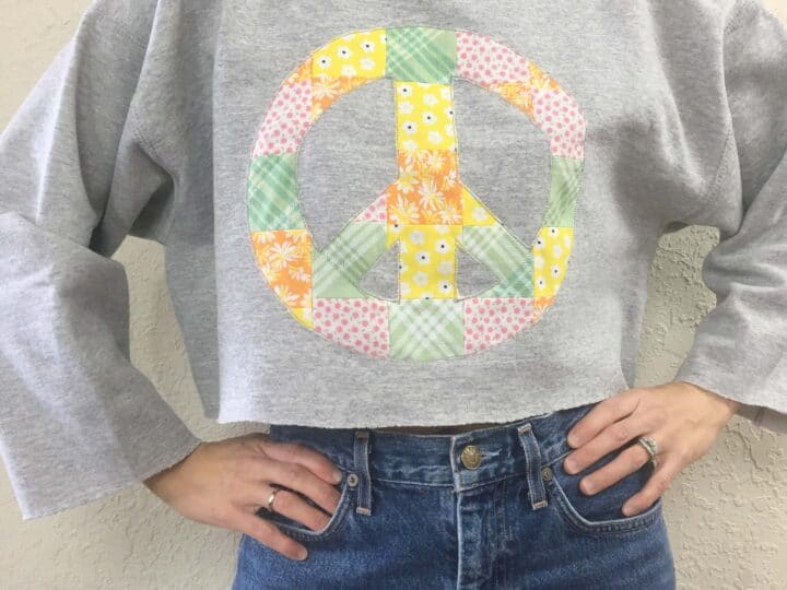 Patchwork peace sign cropped sweatshirt front