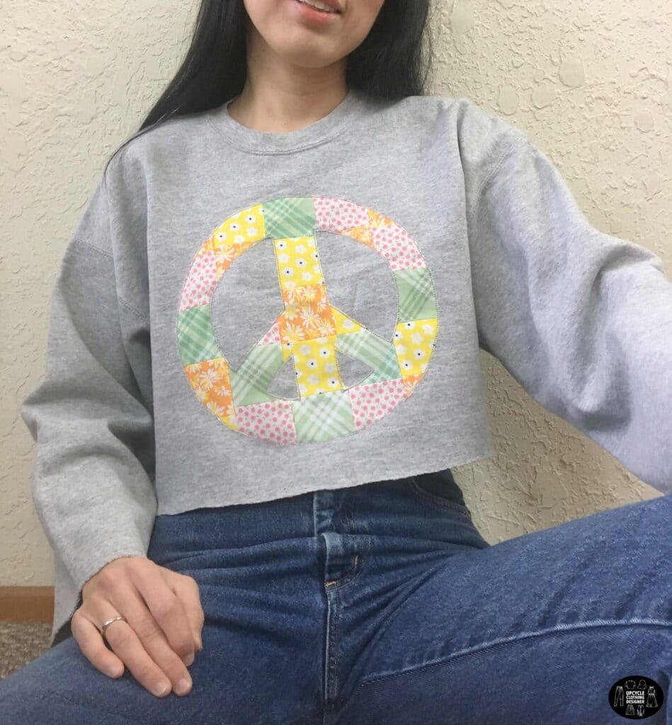 Patchwork peace sign cropped sweatshirt front closeup