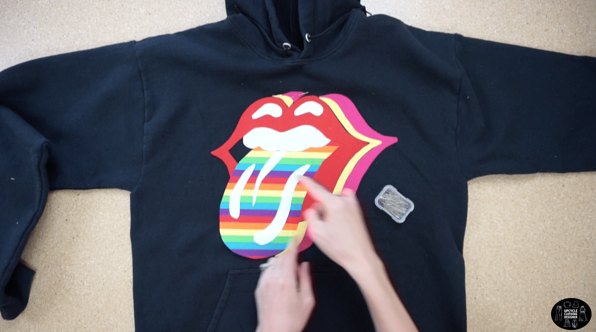 Pin the patchwork motif to secure the positioning on the front of the hoodie