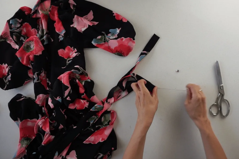 Fold the end of the waist straps inside the tunnel and hand sew along the edge.