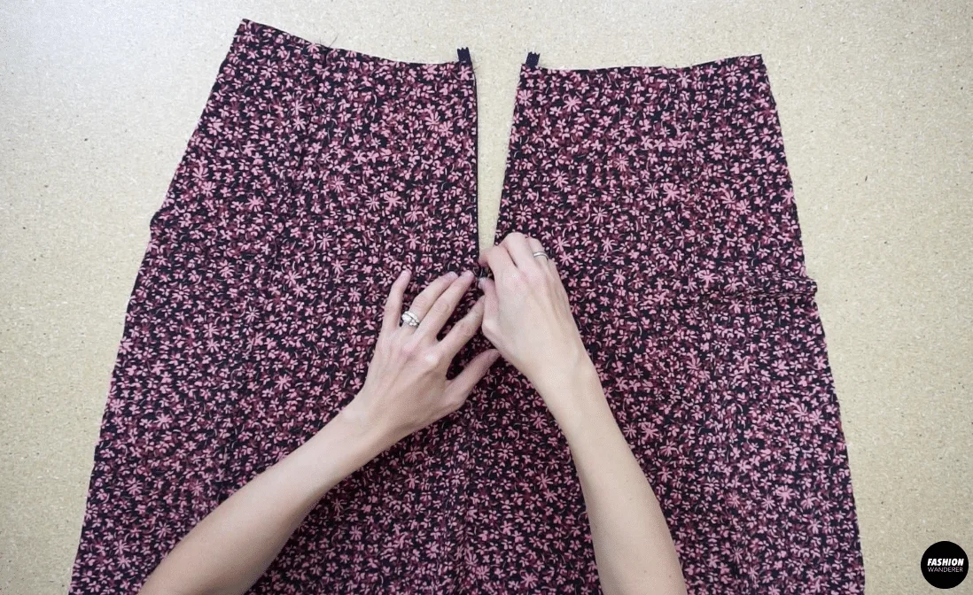 To complete the back of the dress, close the bottom of the center back opening.