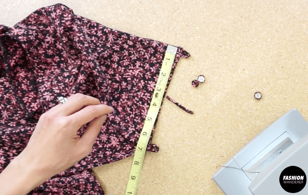Pin to secure, and then straight stitch to attach the button closures to the back opening of the dress.