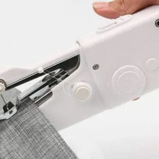 handheld sewing machine to stitch fabric