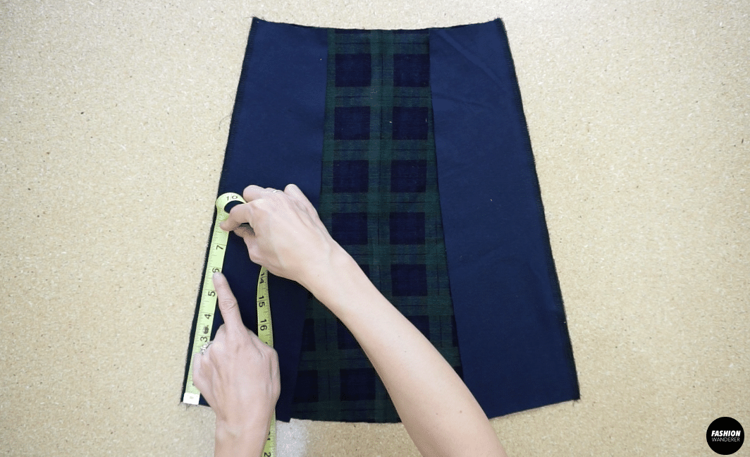 To make a side slit in the mini skirt, measure 6” up from the hemline and mark.