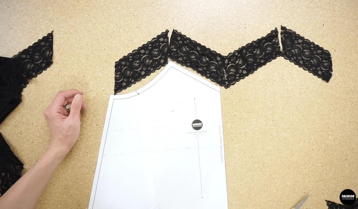 Attach lace trim pieces together to make a M shape that match the neckline.