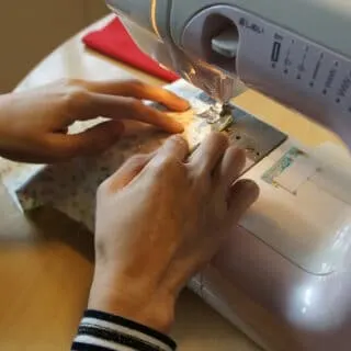 sewing fabric through the sewing machine