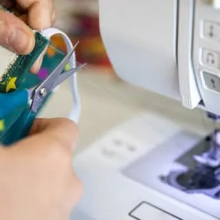 sewing elastic on the fabric using sewing machine