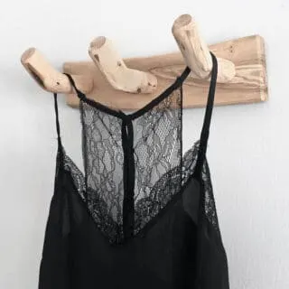 black lace trimmed camisole hanging