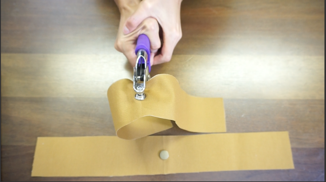 Use plier to add snap button on the facing to tote bag
