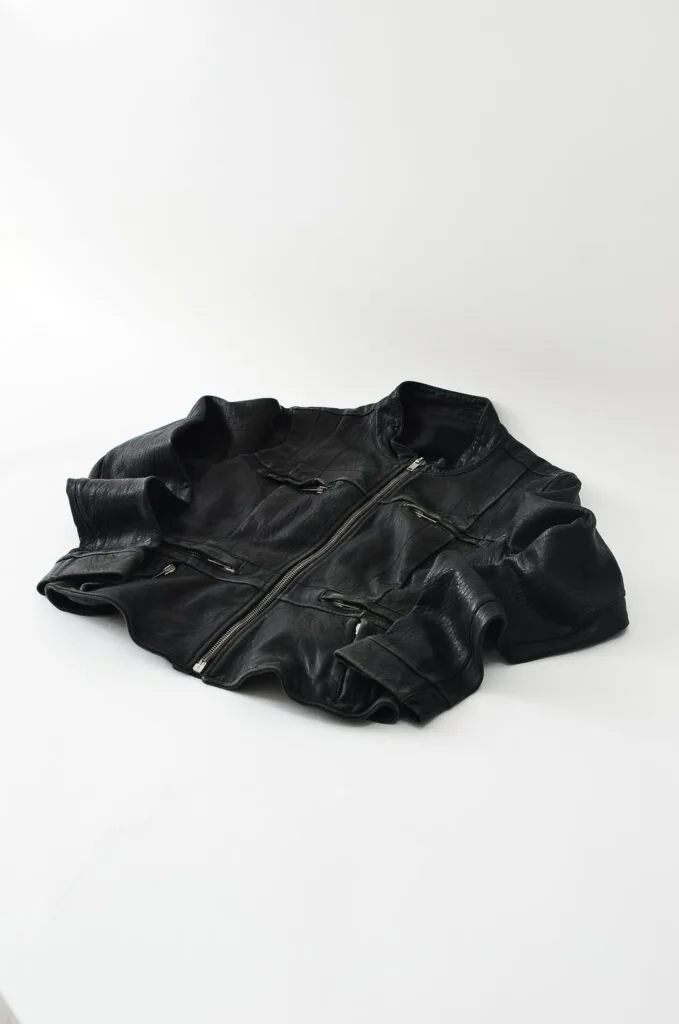 faux leather jacket laying on the ground
