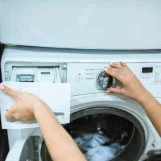 putting homemade laundry detergent in the washing machine