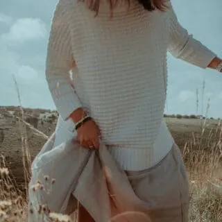 women wearing sweater and long skirt