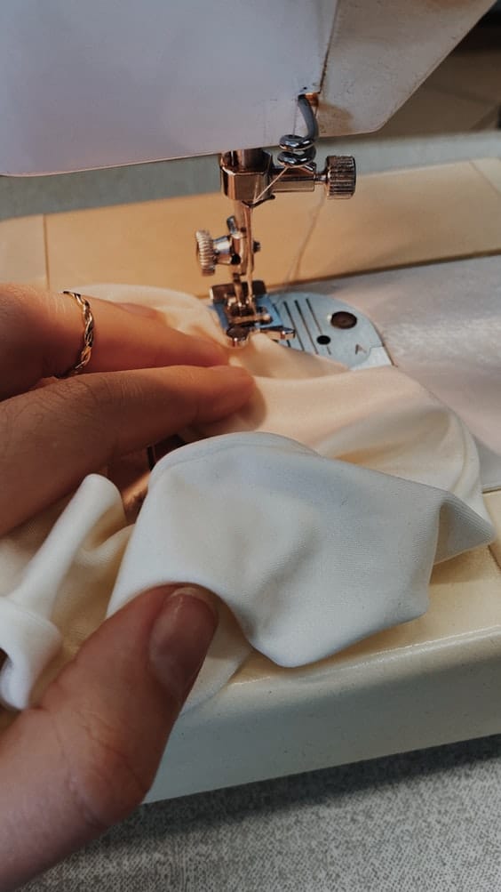 sewing seam on garment using sewing machine
