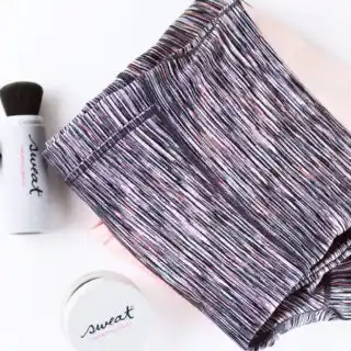 multi colored workout leggings folded on the table