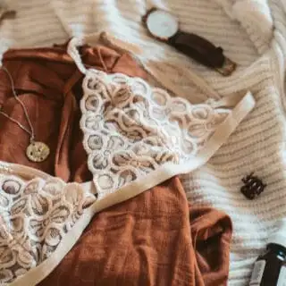 cream color bralette on the bed