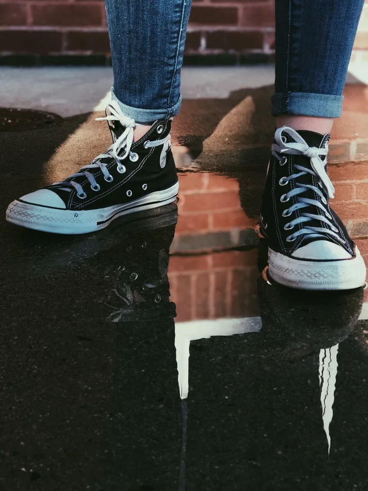 white shoe laces on black shoes