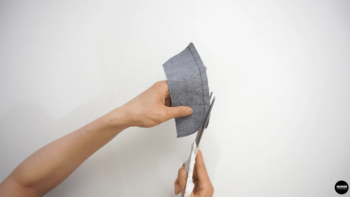 Trim the seam allowance to ¼” and turn the fly shield right side out and press.