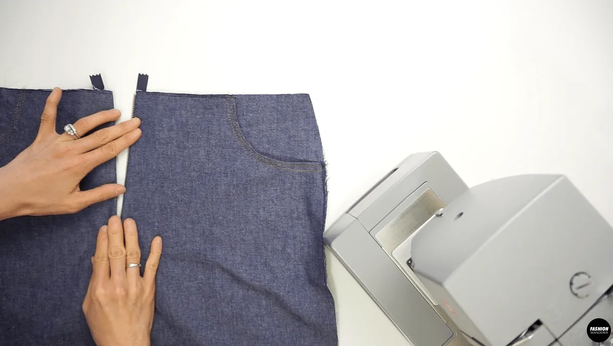 Open the zipper and fold the left side of the pants close to the zipper teeth and edge topstitch.