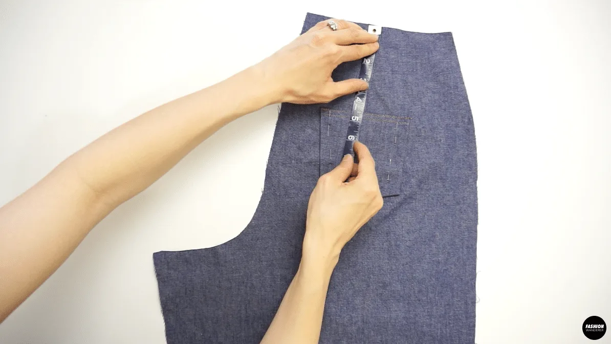 Measure placement of back pocket on back side of jeans