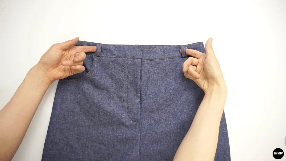 Fold the belt loop on top and bottom to match the starting point of the pants pocket, then edge topstitch ⅛&rdquo; to secure.