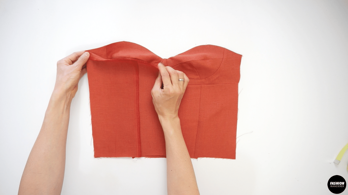 Lay the right side of Front Bustier Bodice and right side of Back Bustier Bodice facing each other and join the seam with ⅜” width; then finish with zigzag stitch.