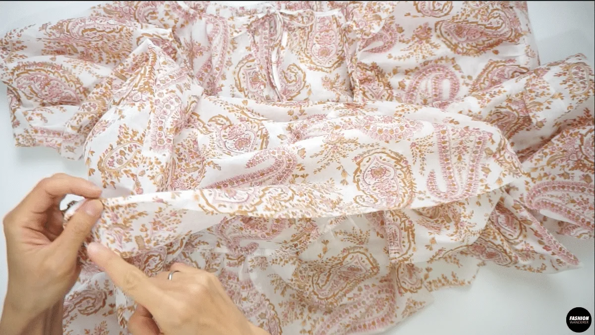 To finish the hem of the dress, narrow double fold the hem ¼” width and straight stitch the hemline.